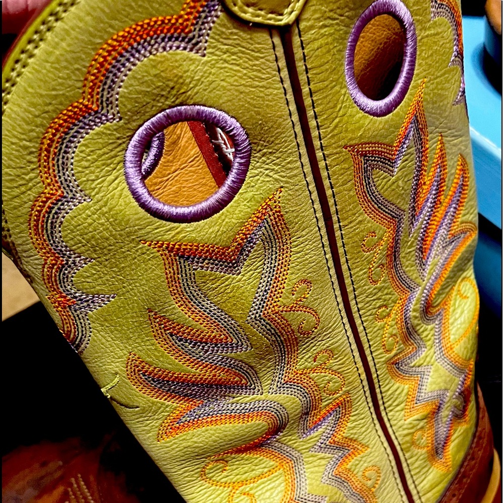 Worn once twisted X boots with tan leather on foot